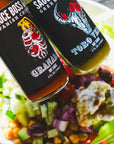 Smoky chipotle hot sauce and toro verde jalapeno pepper hot sauce over a mediterranean bowl.