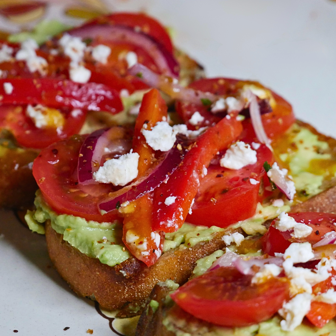 Sauce Boss Gang Liquid Gold mango scotch bonnet hot sauce on avocado toast.