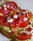 Sauce Boss Gang Liquid Gold mango scotch bonnet hot sauce on avocado toast.