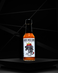 Sauce Boss Gang mustardseed scorpion pepper hot sauce front view.