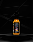 Sauce Boss Gang "Liquid Gold" hot sauce back bottle view.