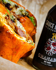 Sauce Boss Gang smoky chipotle hot sauce on a breakfast burrito.