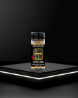 Lemon Fuego seasoning container on a black platform with a dark background