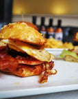 Sauce Boss Gang smoky chipotle hot sauce on a breakfast biscuit.