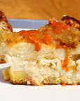 Sauce Boss Gang mustardseed scorpion pepper hot sauce on cheesecake.
