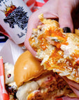 Sauce Boss Gang mustardseed scorpion pepper hot sauce on a cheeseburger.