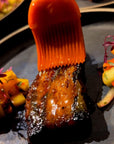 Sauce Boss Gang mustardseed scorpion pepper hot sauce on a short rib.