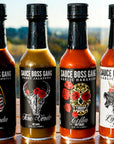 Sauce Boss Gang "Whole Gang " hot sauce collection on a table in the sunlight.