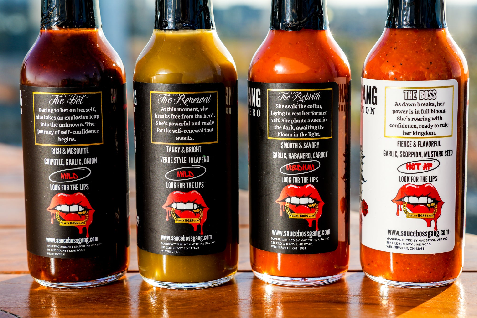 Sauce Boss Gang " Whole Gang " hot sauce collection back of hot sauce bottles.