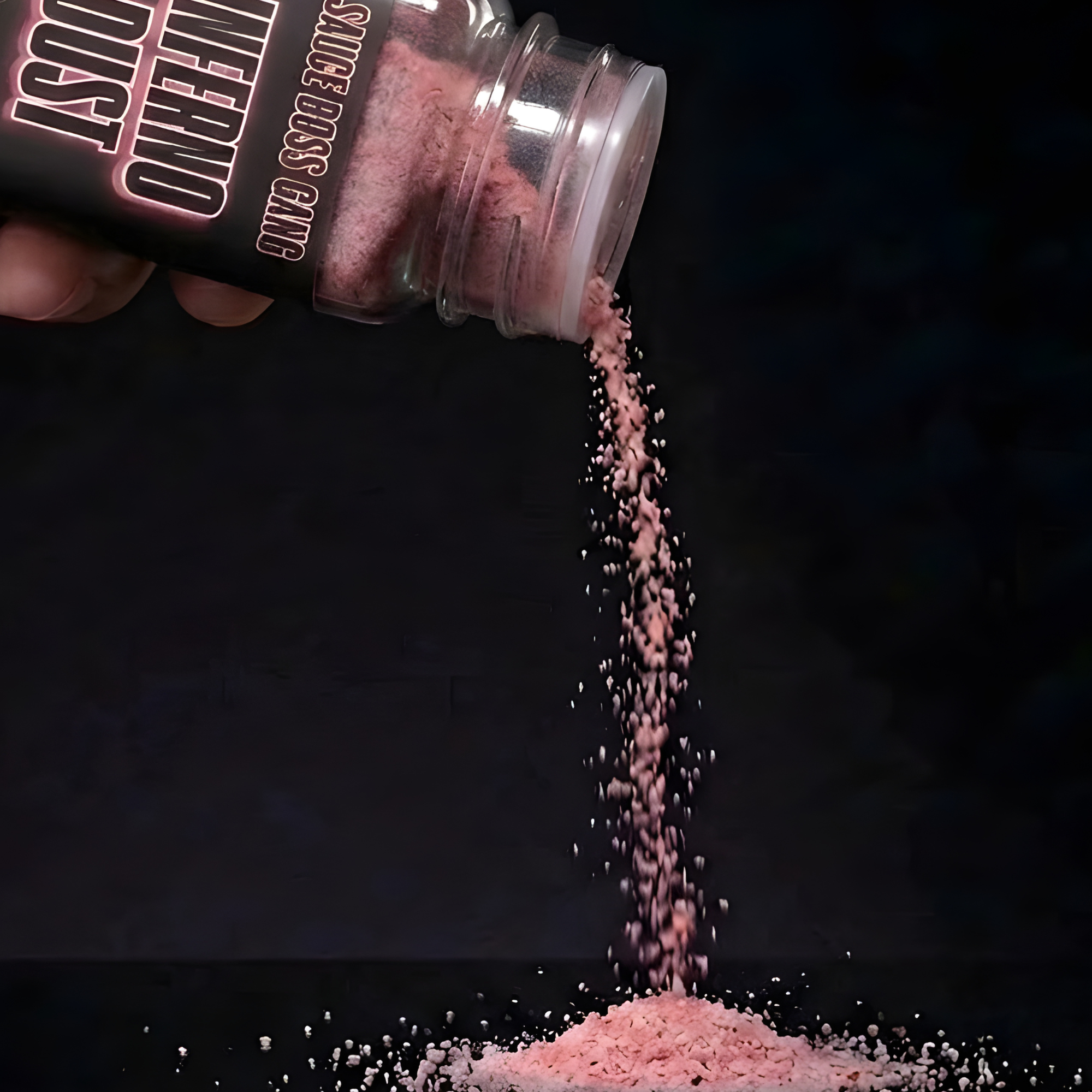 Chile Lime seasoning being poured from a container labeled 'Sauce Boss Gang against a black background