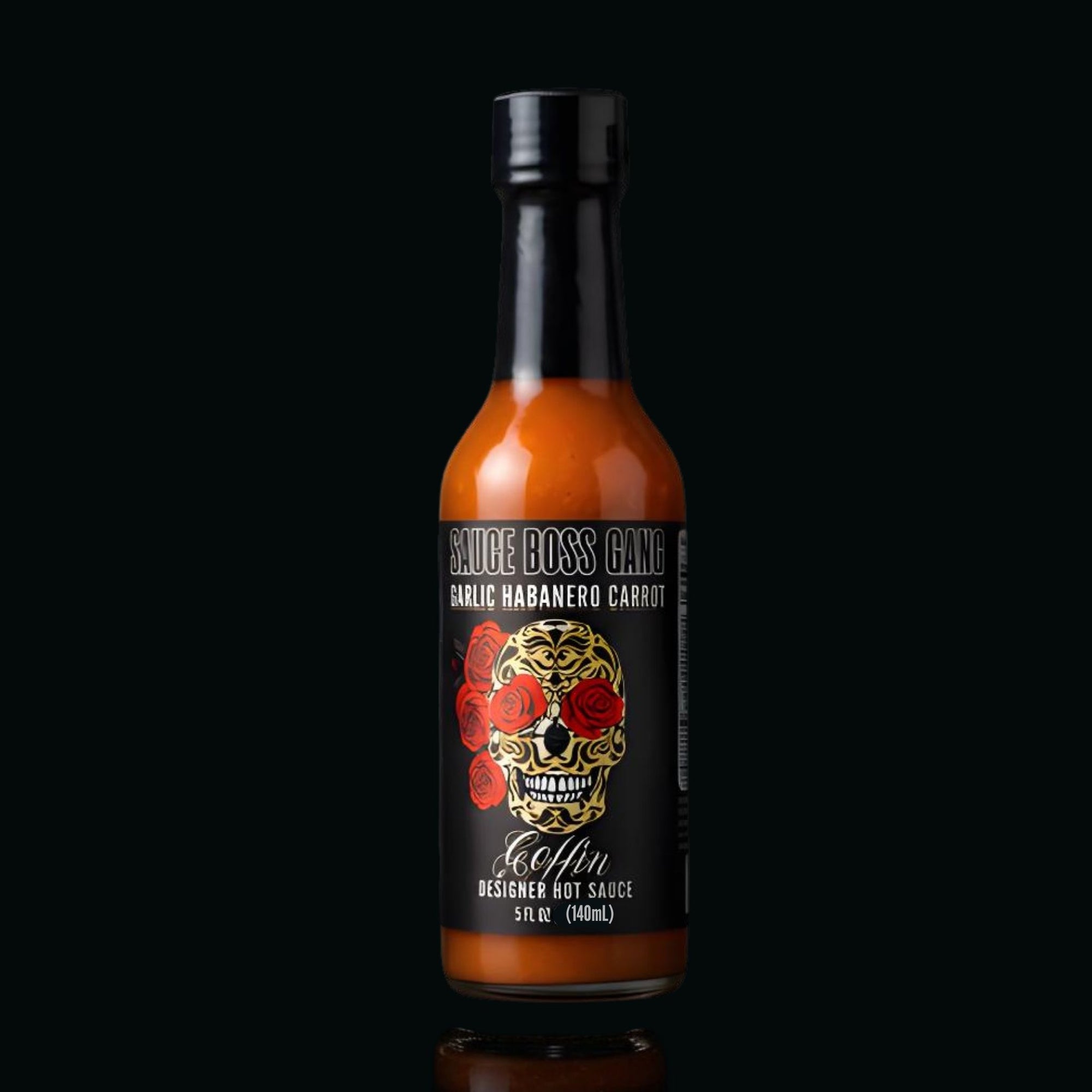 Hot sauce bottle with a black label featuring a skull design on a black background