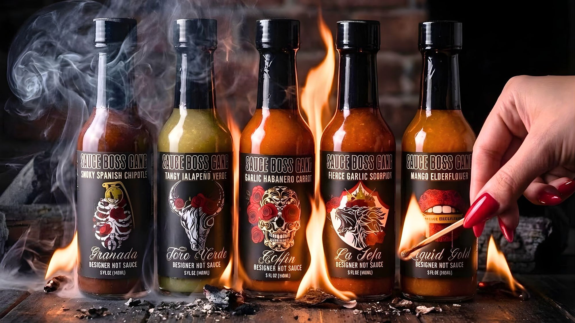 Five bottles of Sauce Boss Gang Hot Sauce with flames and smoke effects on a dark background.