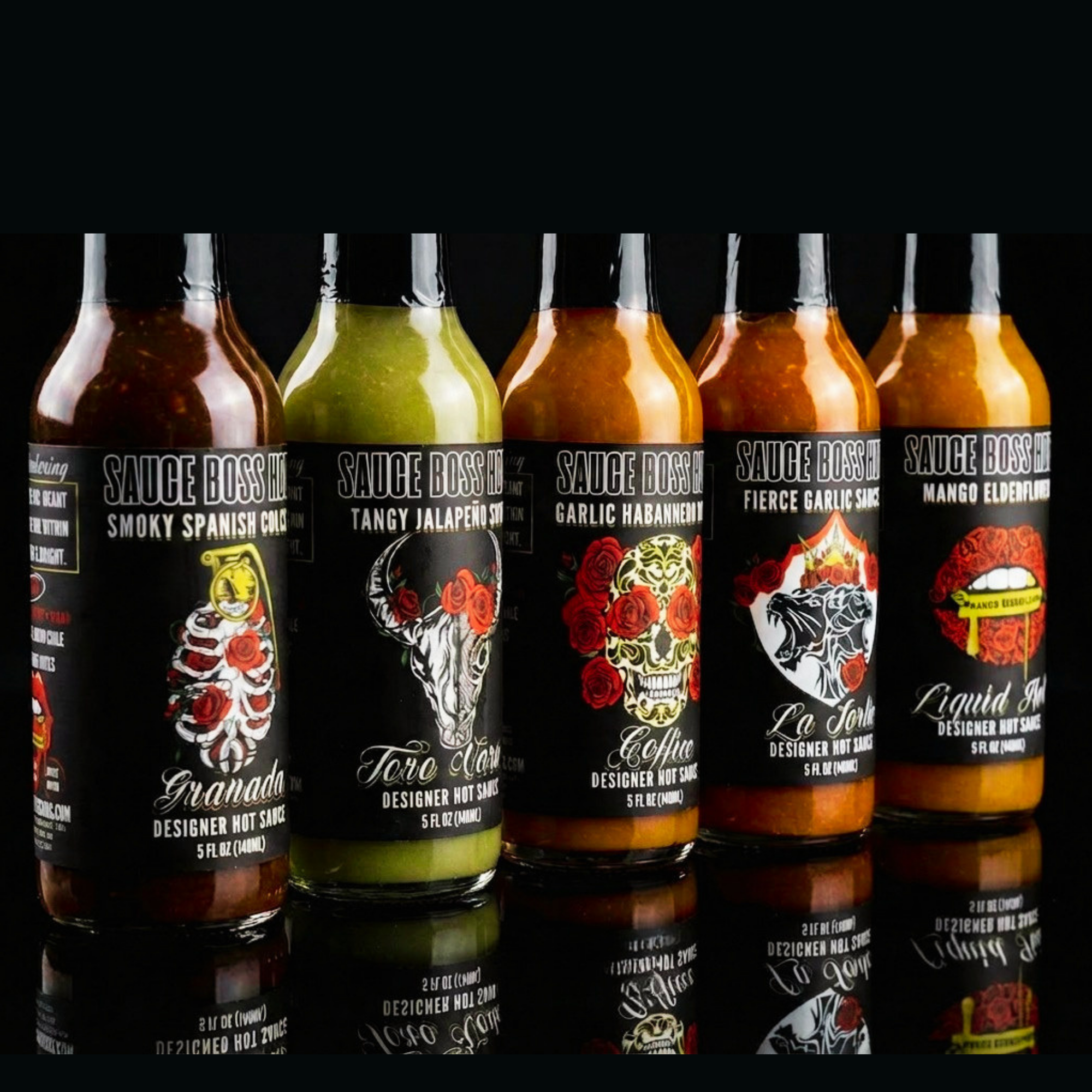 Set of Sauce Bossini hot sauce bottles with colorful labels on a black background