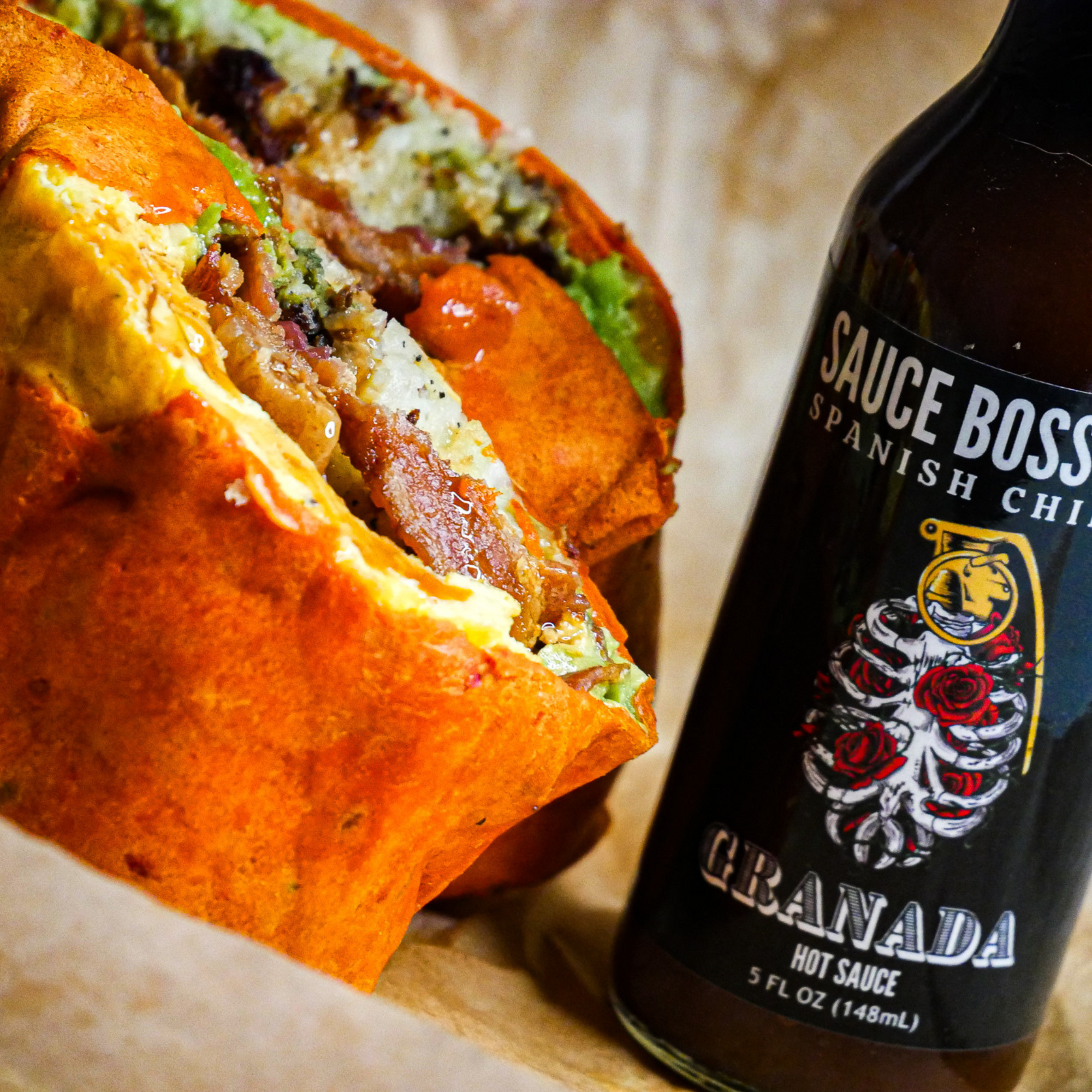 Sauce Boss Gang smoky chipotle hot sauce on a breakfast burrito.