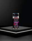 Bottle of Inferno Dust seasoning on a black platform with a dark background