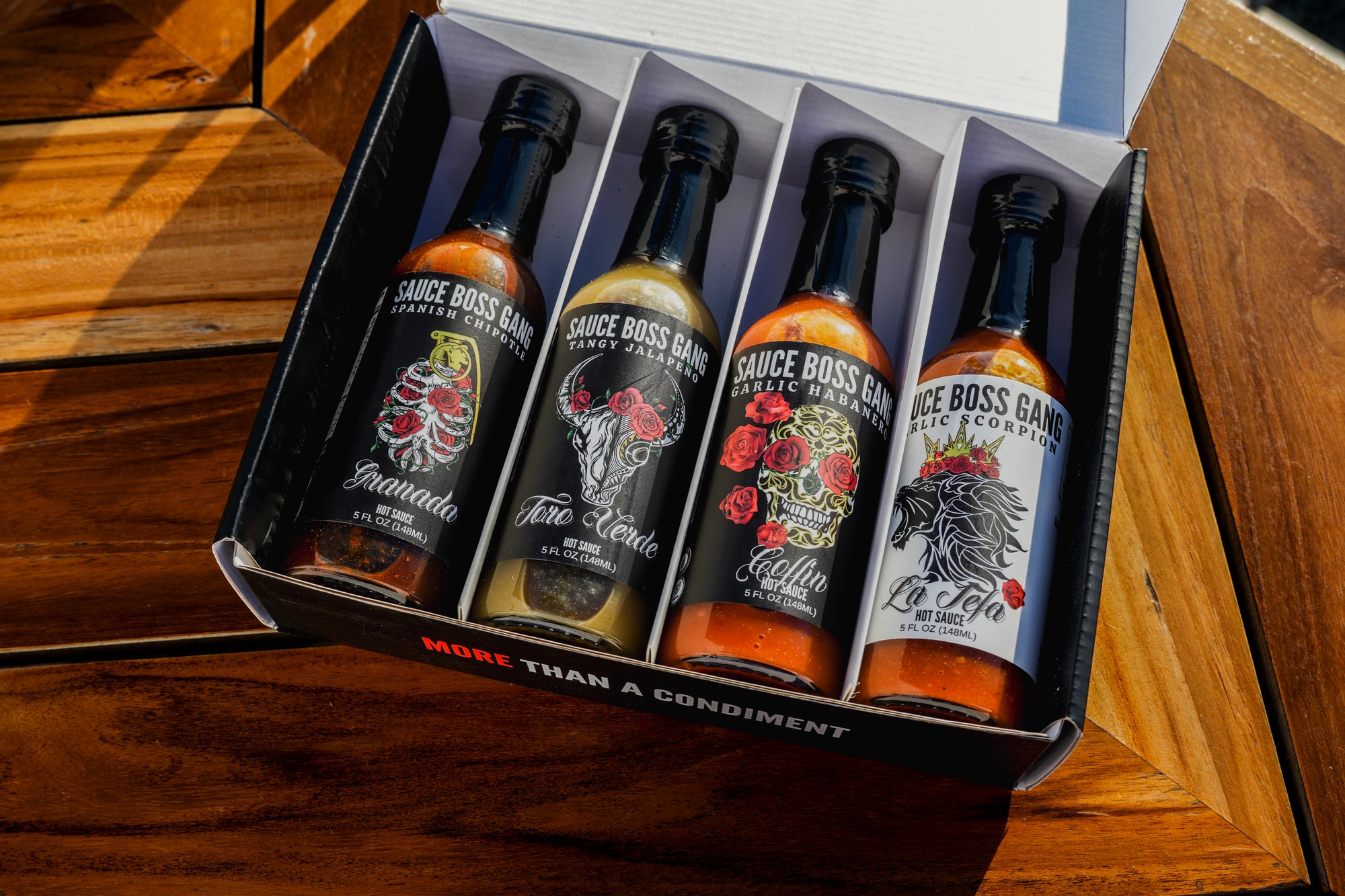 Sauce Boss Gang &quot;The Whole Gang &quot;hot sauce collection in open gift box.