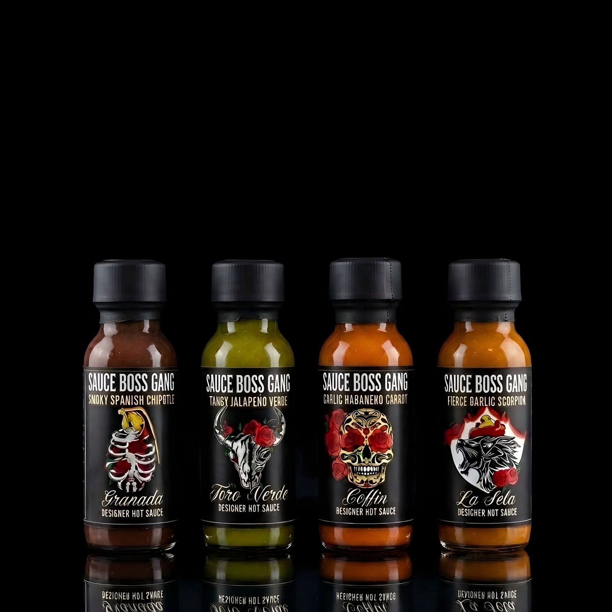 Four bottles of Sauce Boss Gang hot sauce with black caps on a reflective surface.