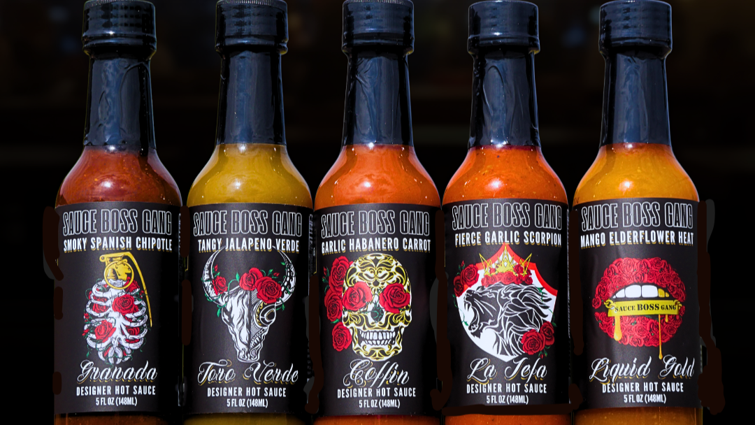 sauce boss gang hot sauce bottles on a table