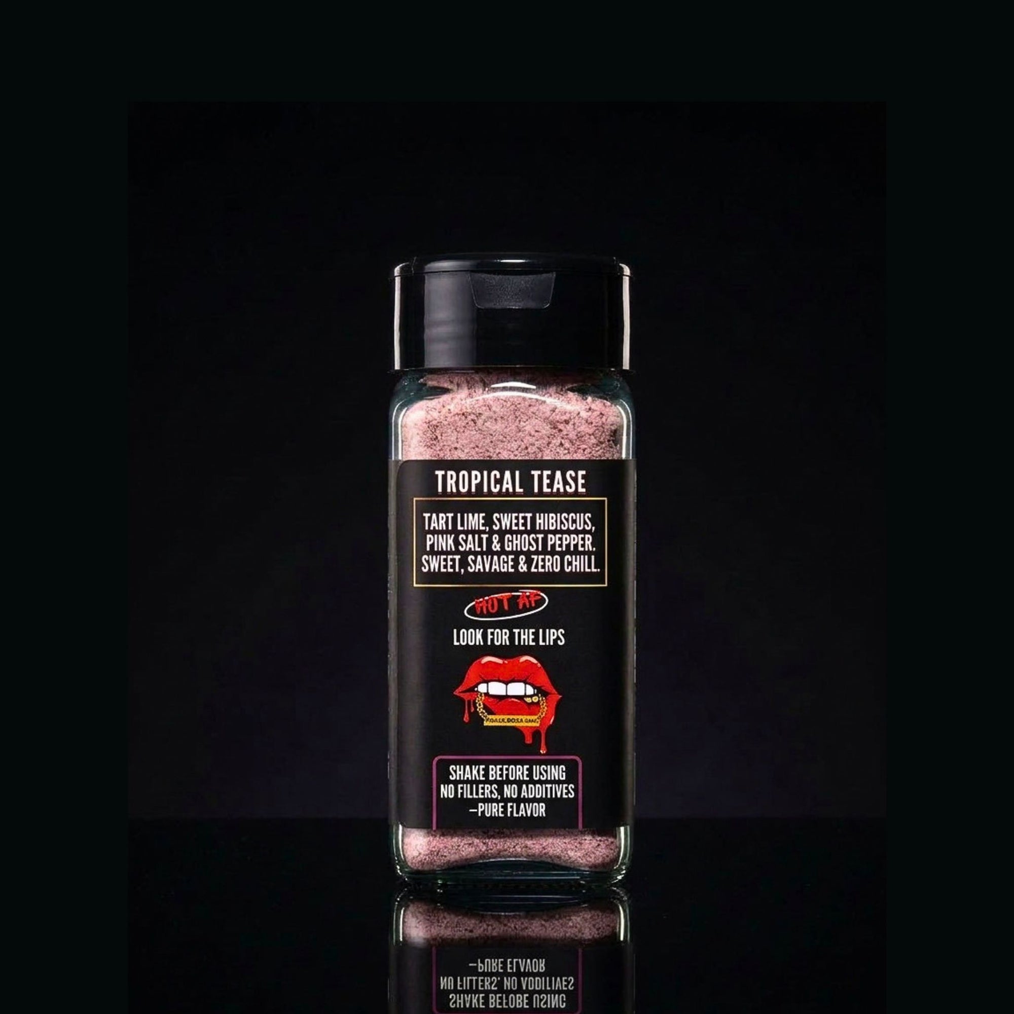 Spice container labeled 'Tropical Tease' with a black background