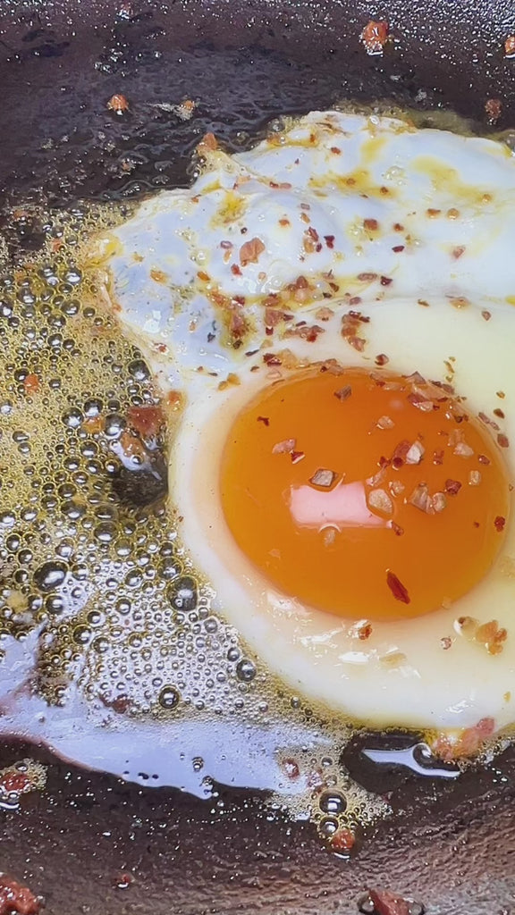 Sauce Boss Gang Volcanic Kiss seasoning on an over easy egg.